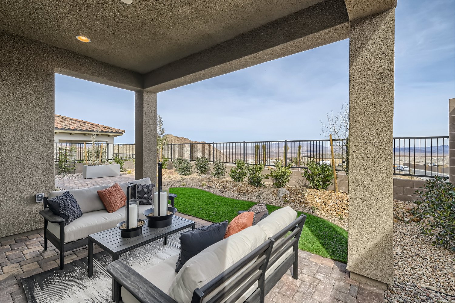 A patio with a table and chairs.