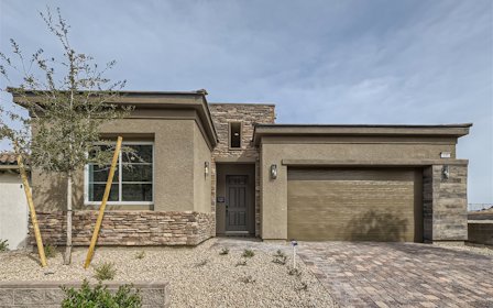 A house with a tree in the front.
