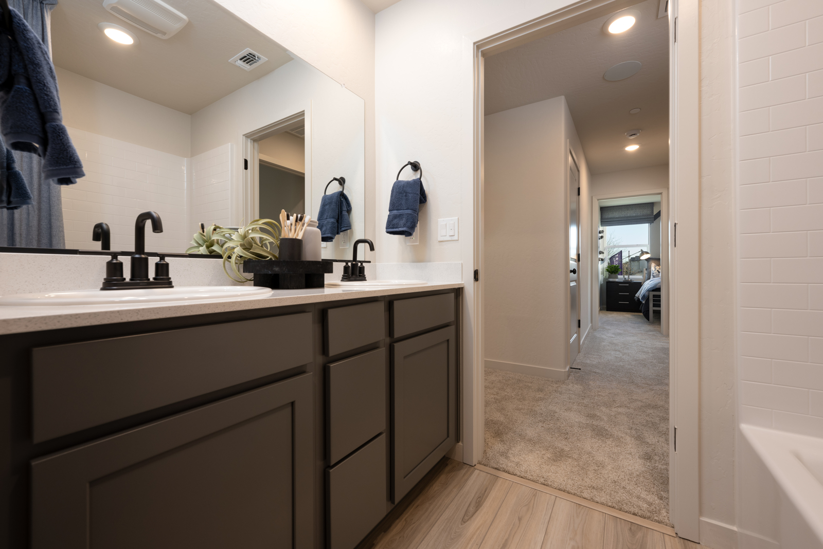 A bathroom with a large mirror.