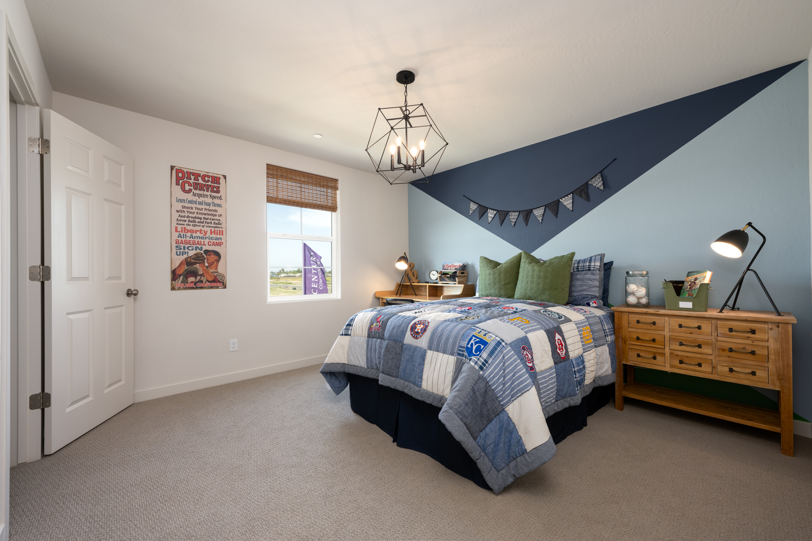 A bedroom with a bed and a dresser.