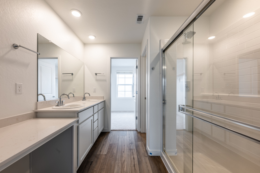 A bathroom with a glass shower.
