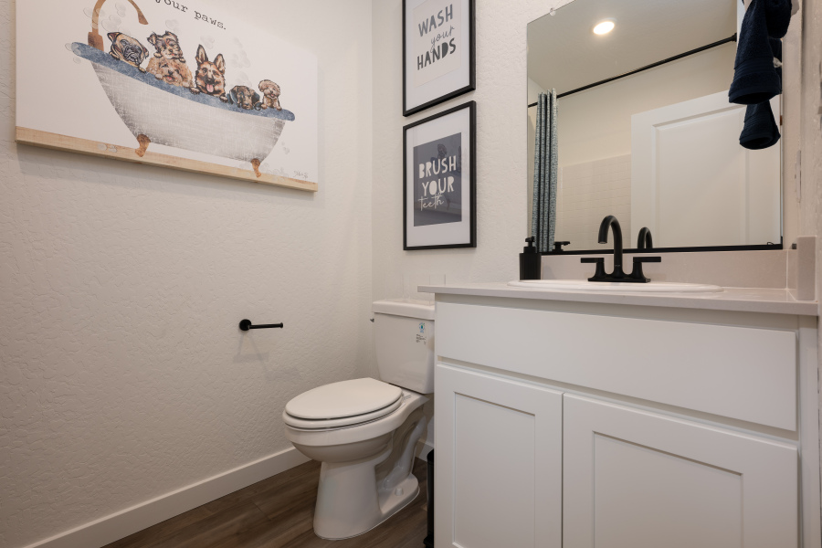 A bathroom with a toilet and a sink.