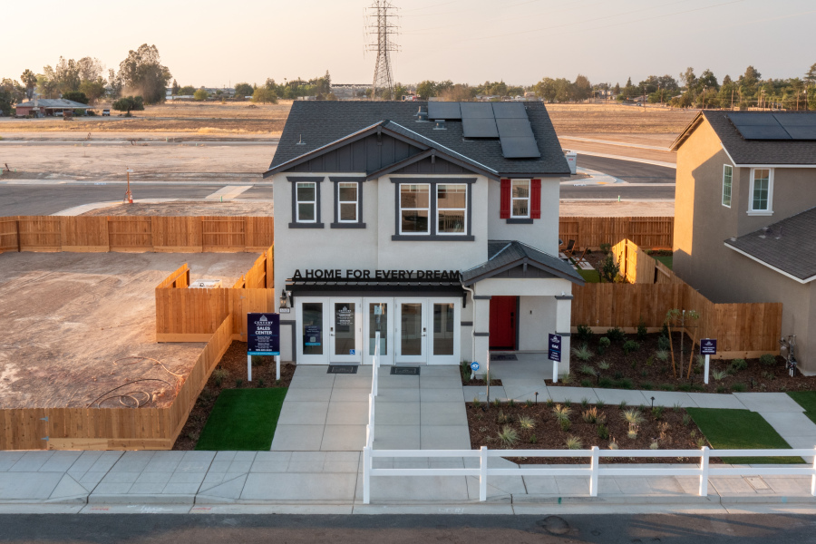 A building with a white fence.