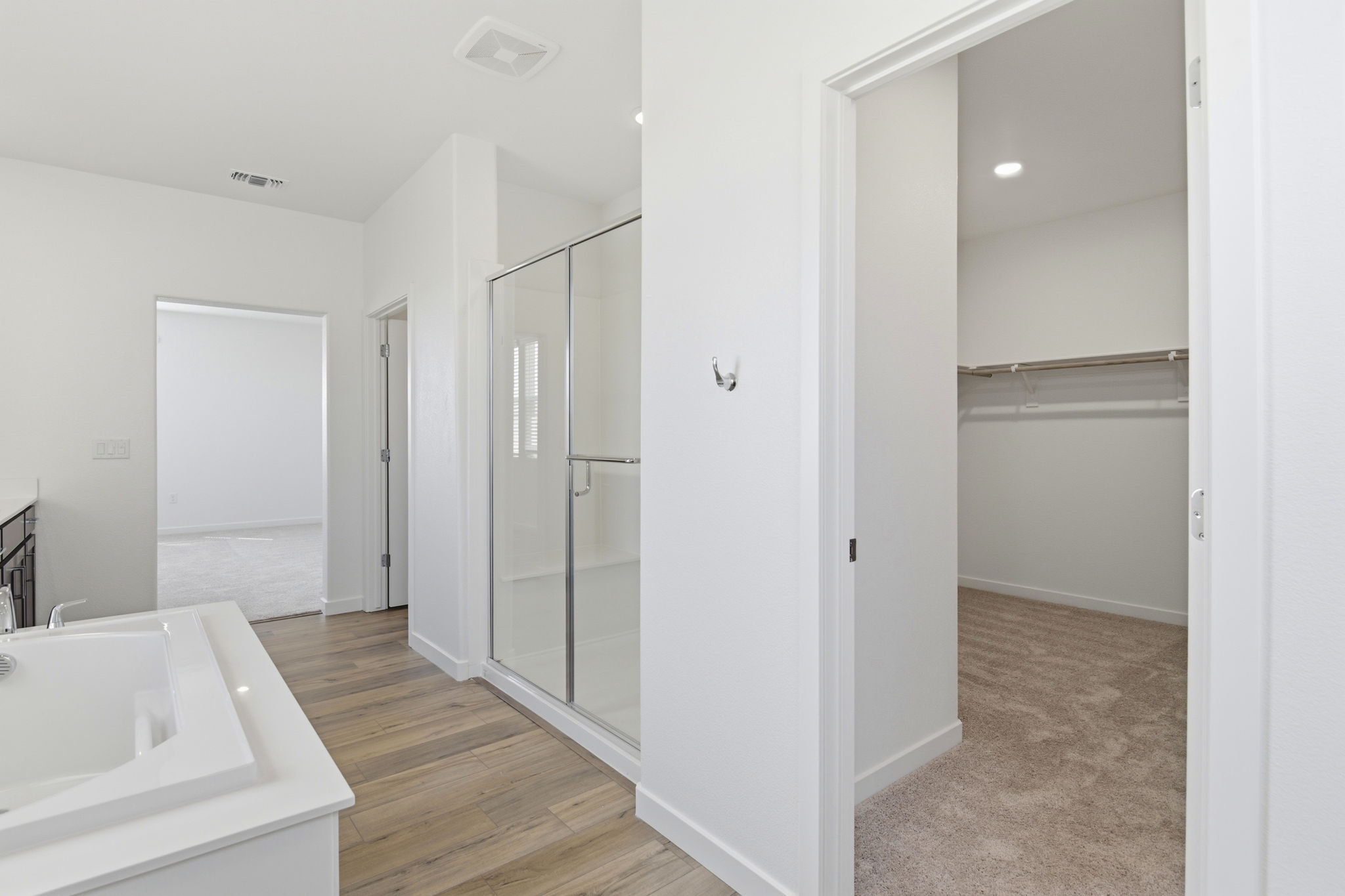 A bathroom with a glass shower.