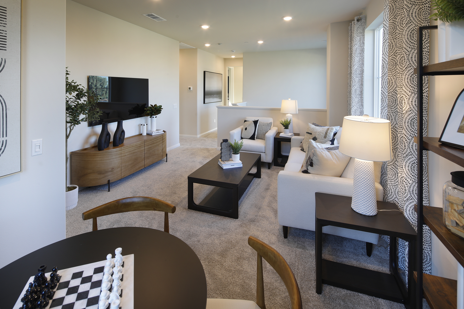 A living room with a large mirror.