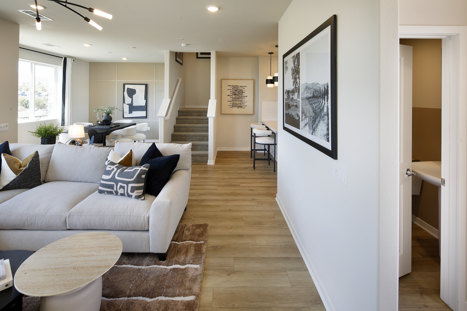 A living room with a couch and a table.