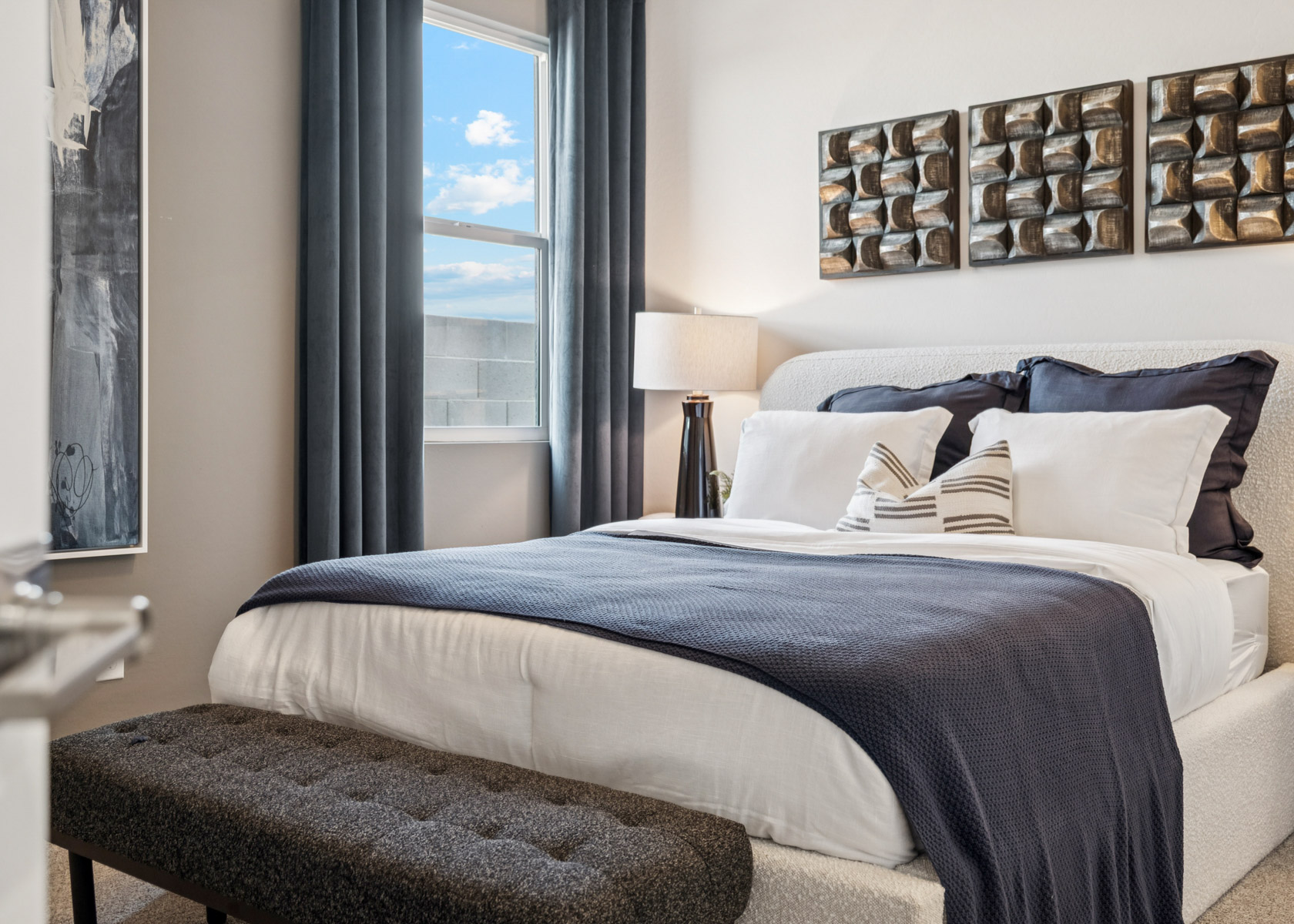 A bed with a large window.