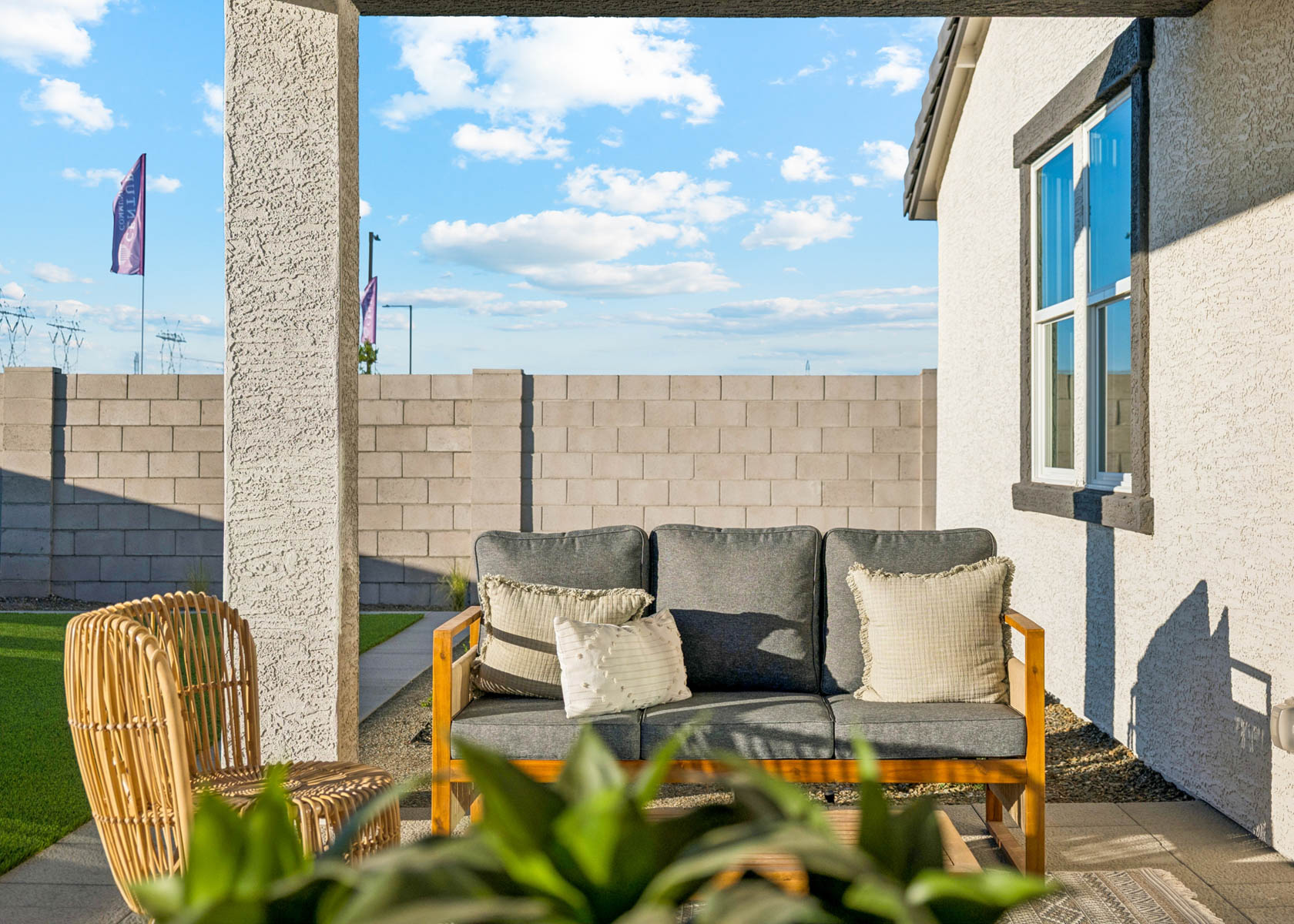 A couch and chairs outside.