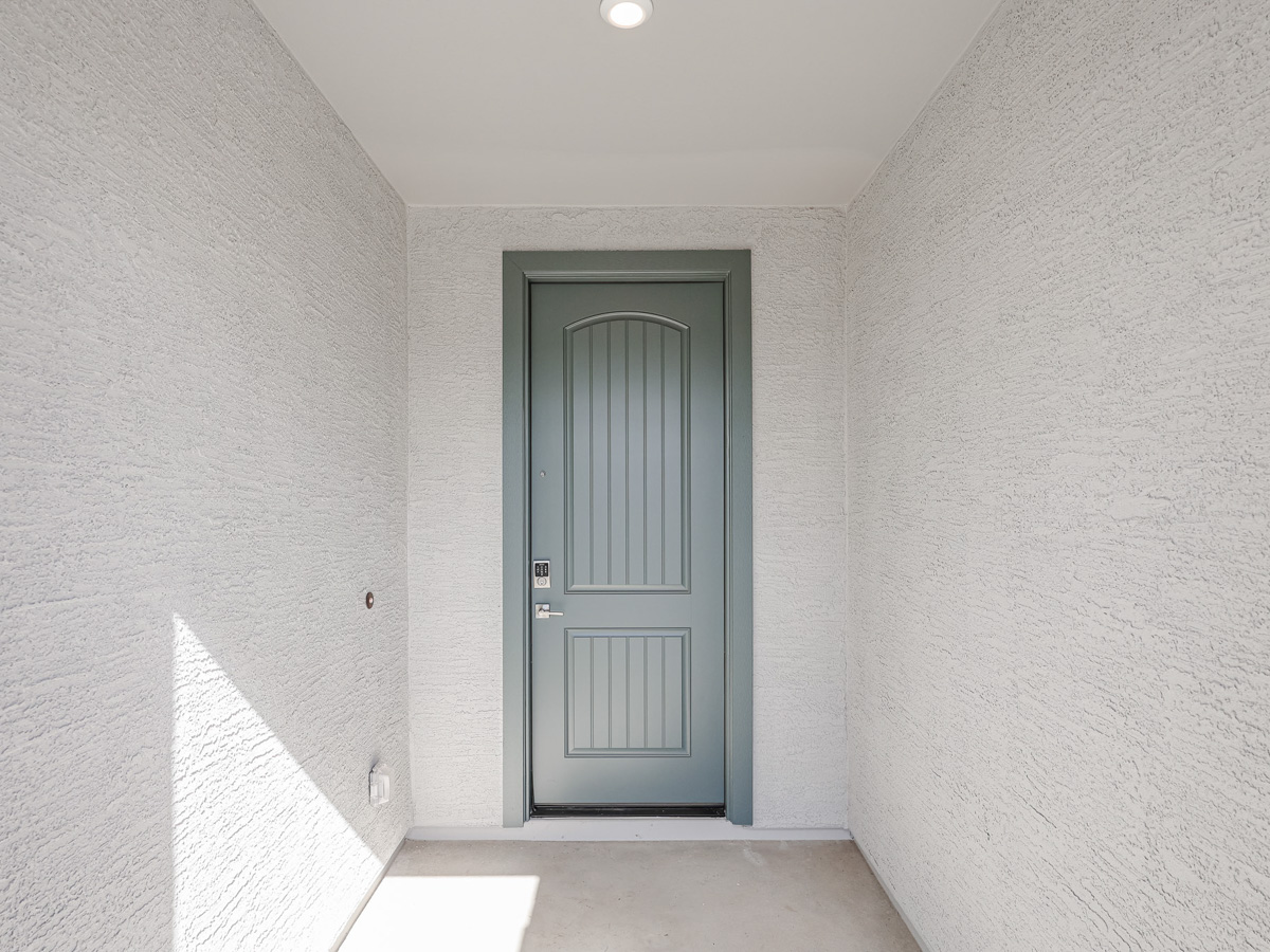 A white door in a room.