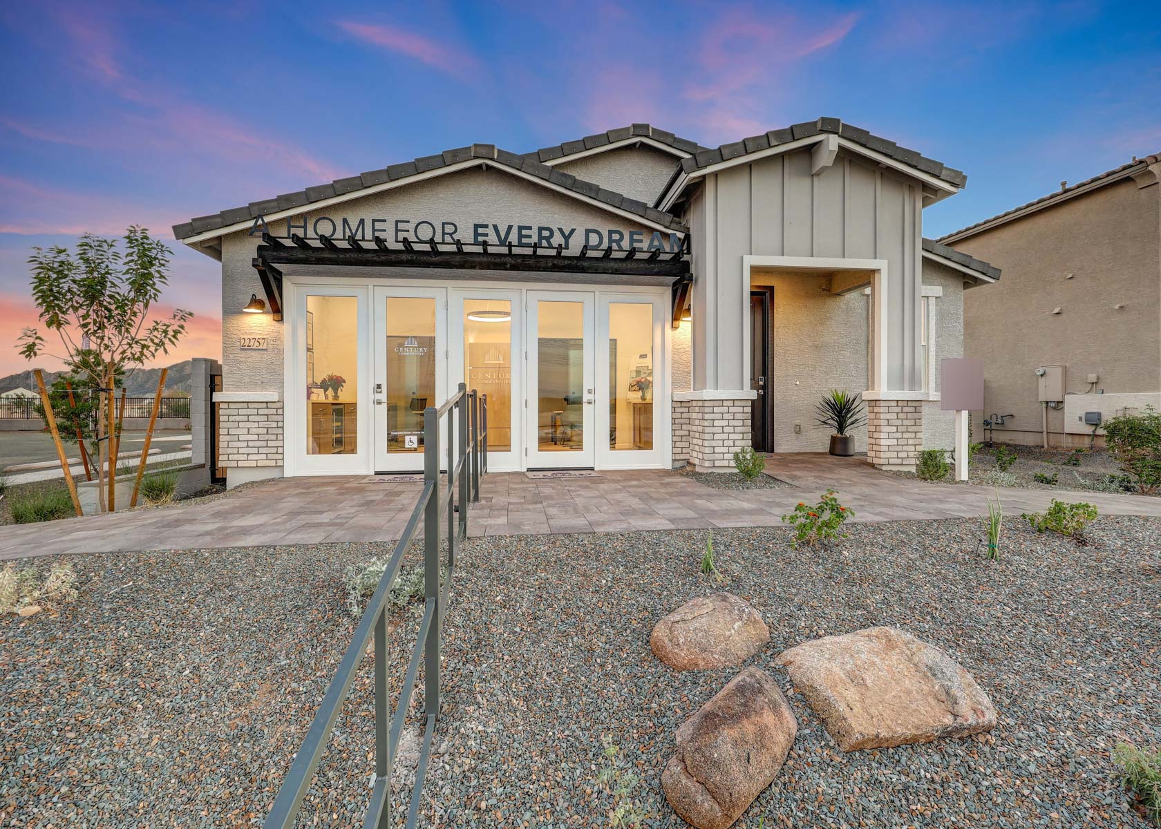 A house with a stone patio.