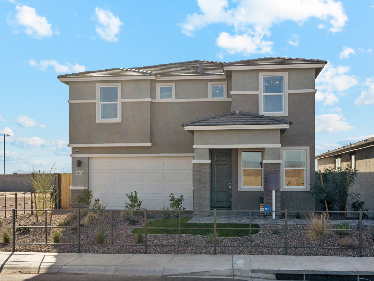 A house with a fence around it.
