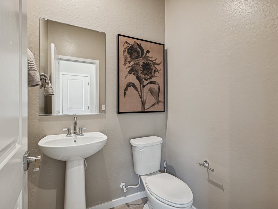 A bathroom with a toilet and sink.
