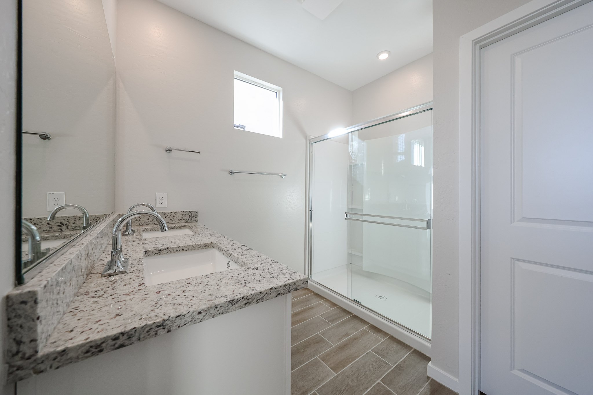 A bathroom with a glass shower.