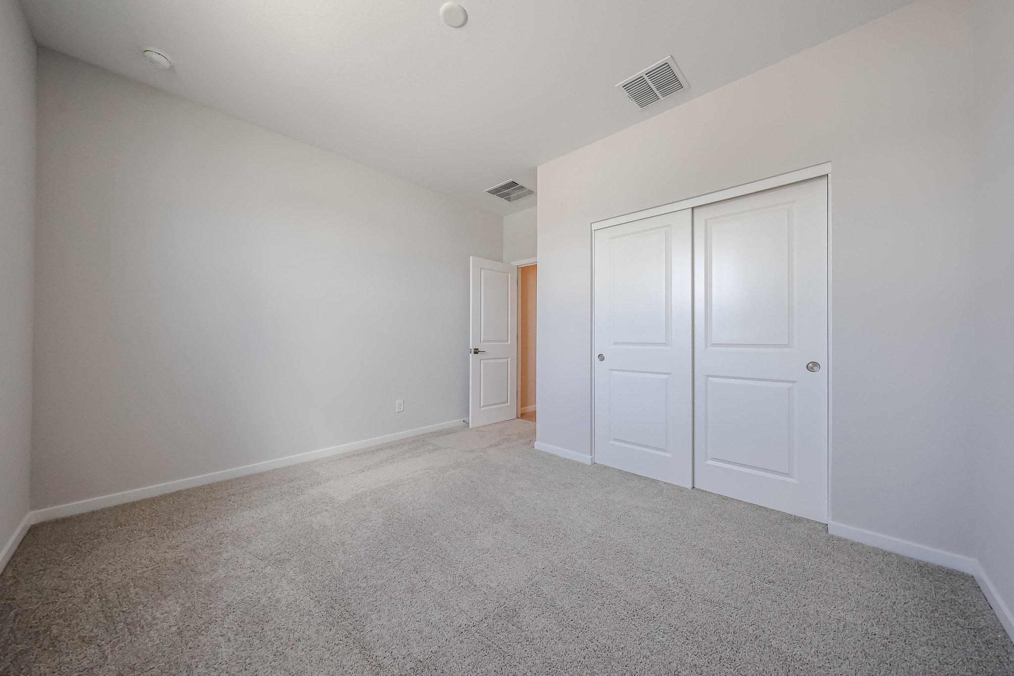 A room with white doors.