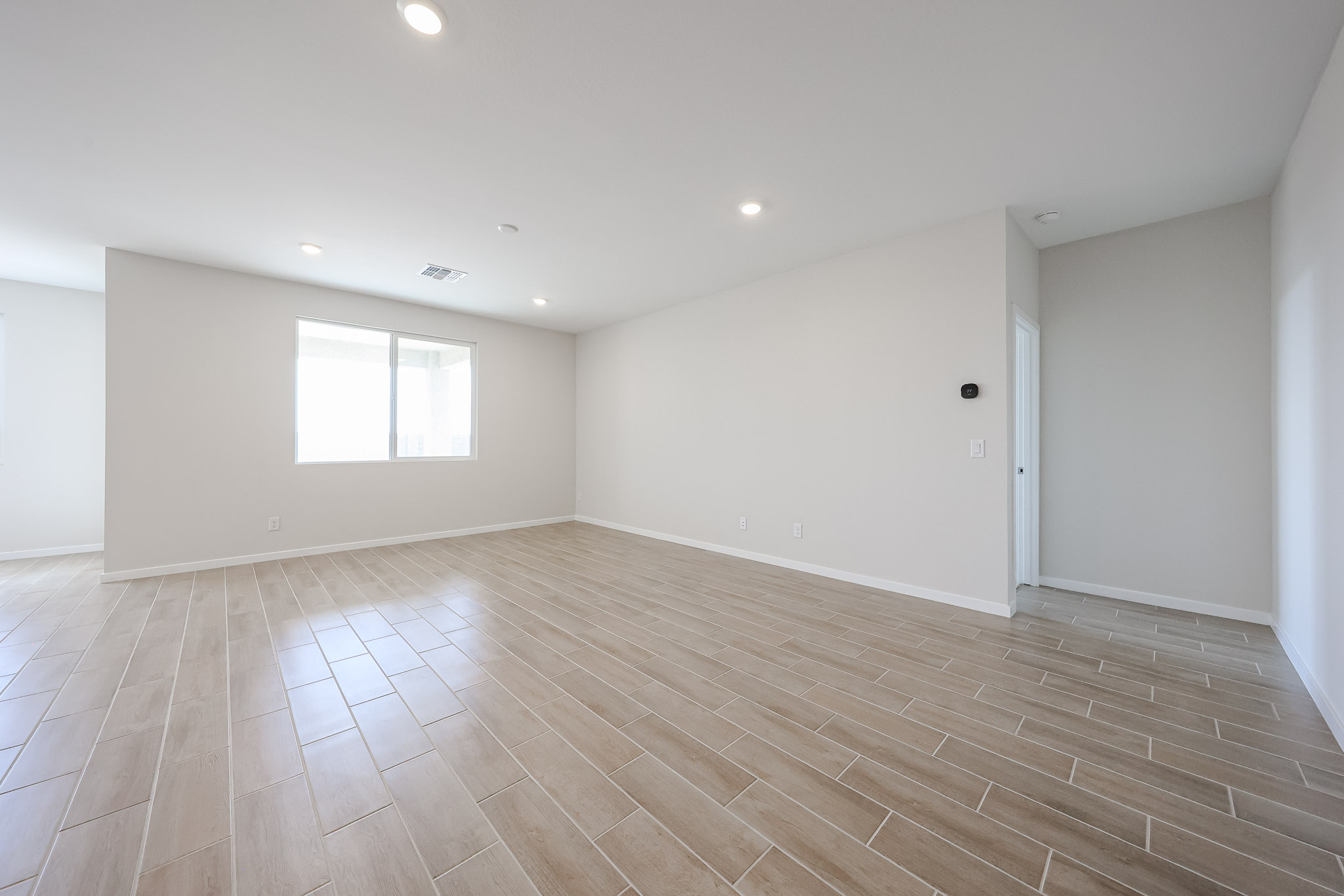 A room with a wood floor and a wood floor.