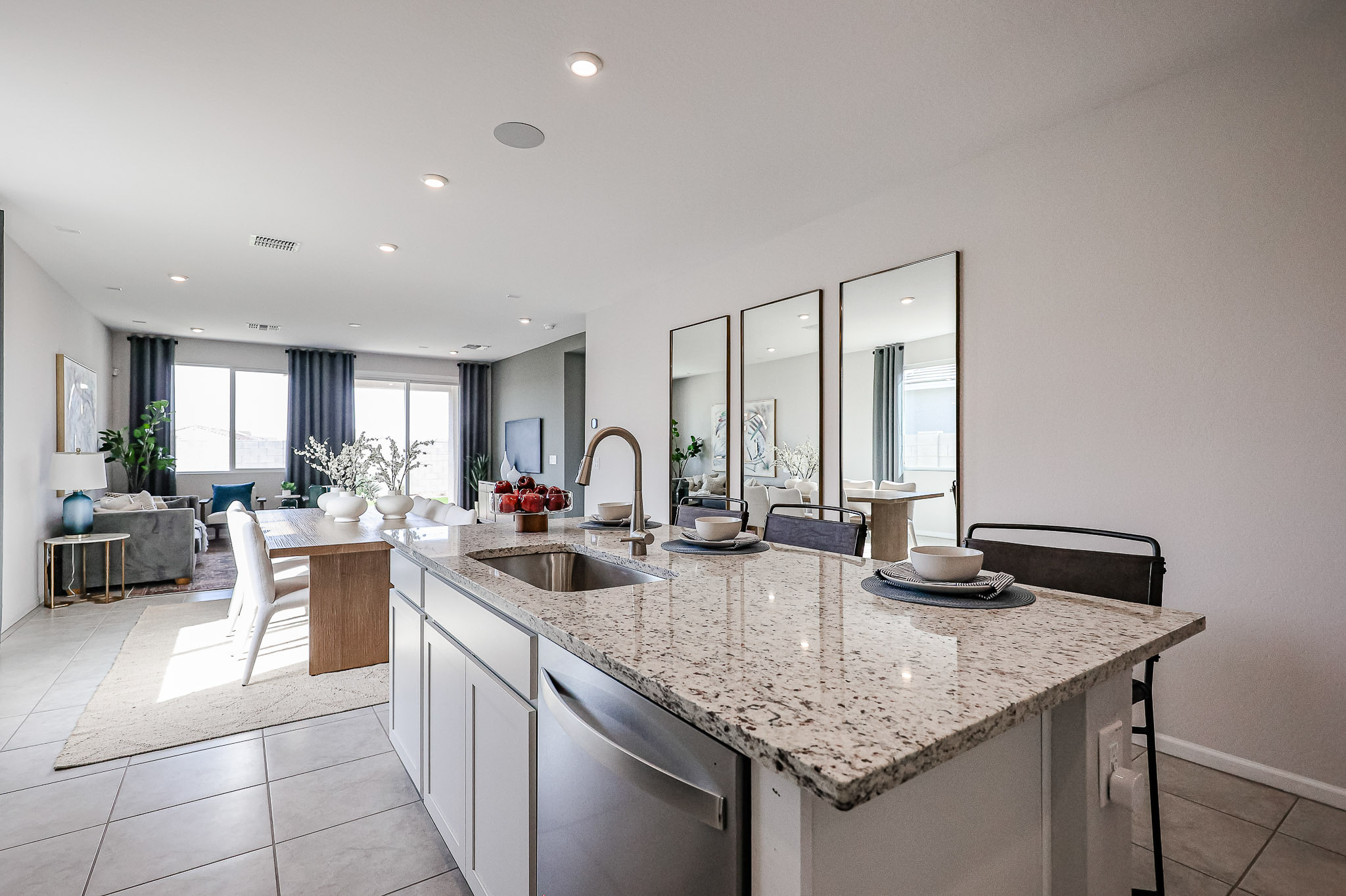 A kitchen with marble counters.