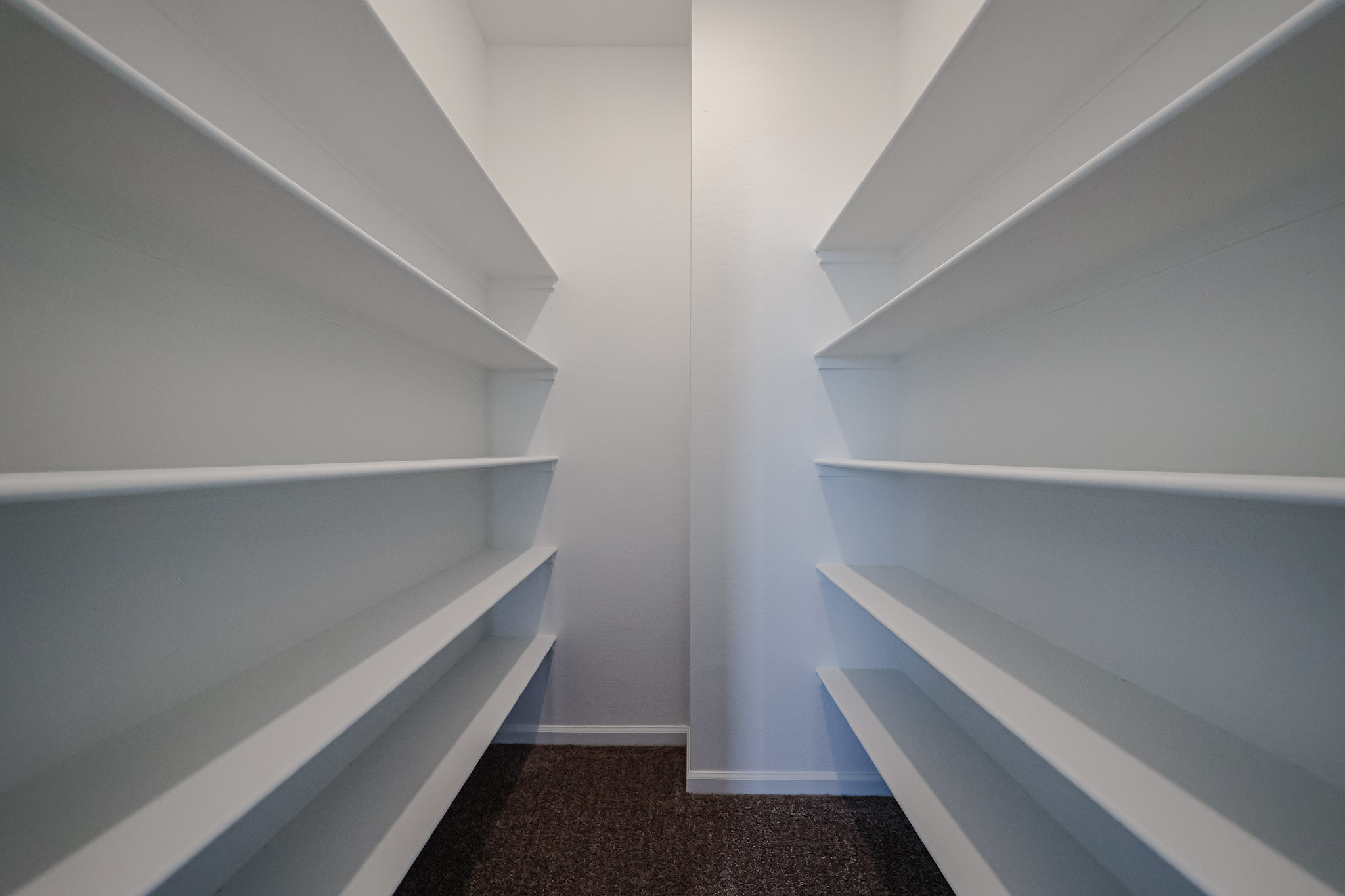 A staircase with white walls.