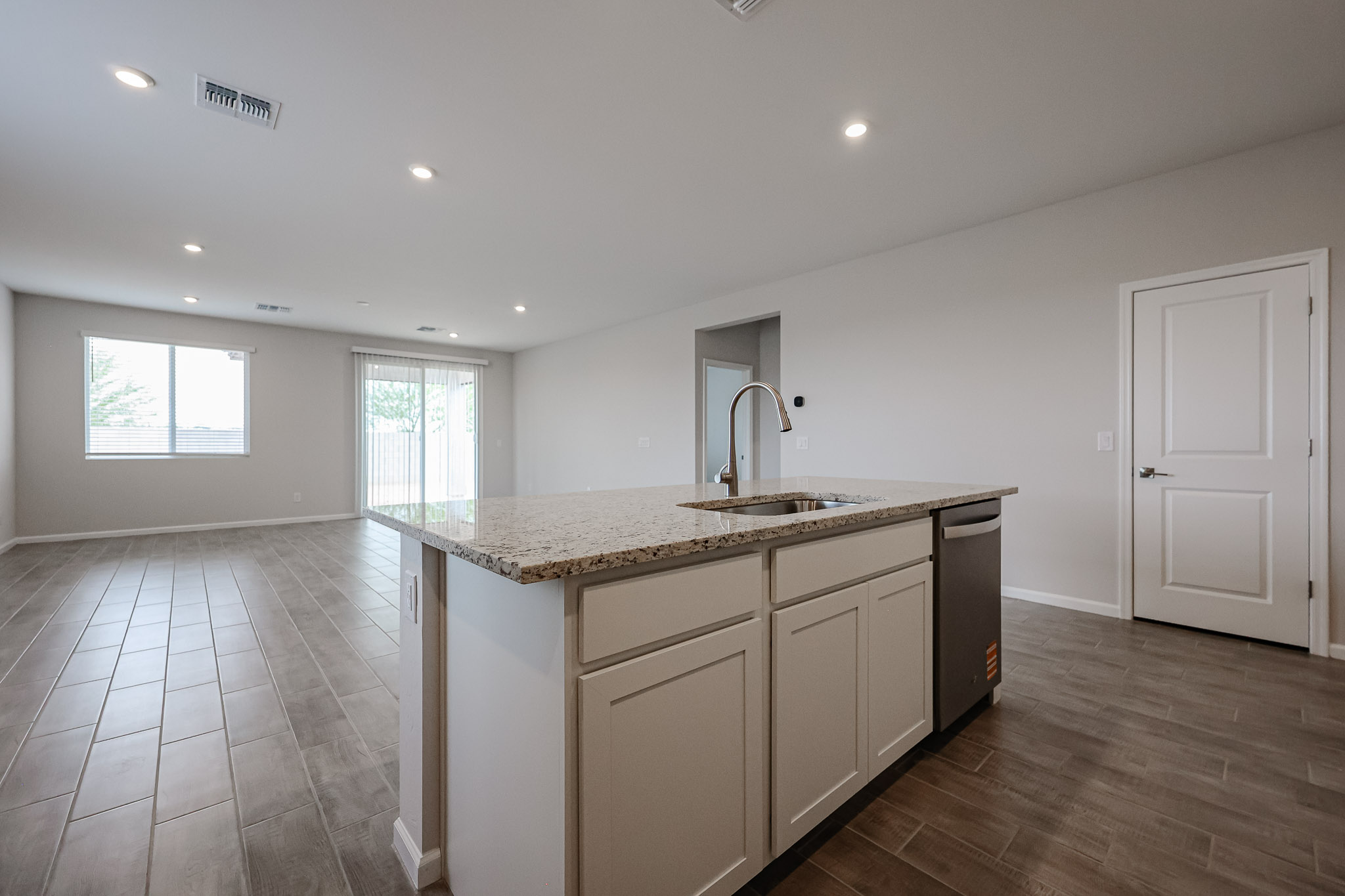 A kitchen with a marble countertop.