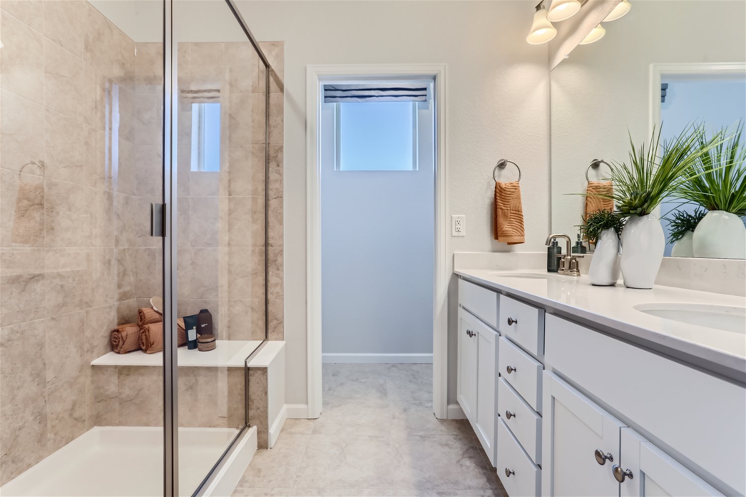 A bathroom with a glass shower.