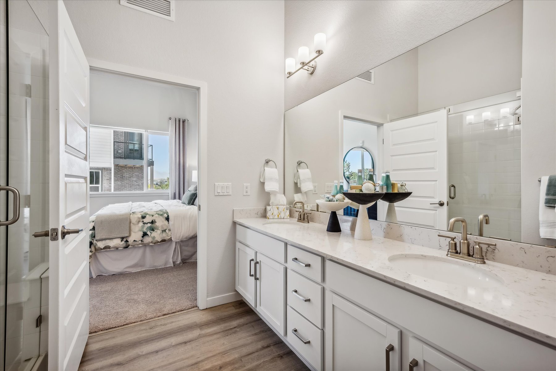 A bathroom with a sink and a mirror.