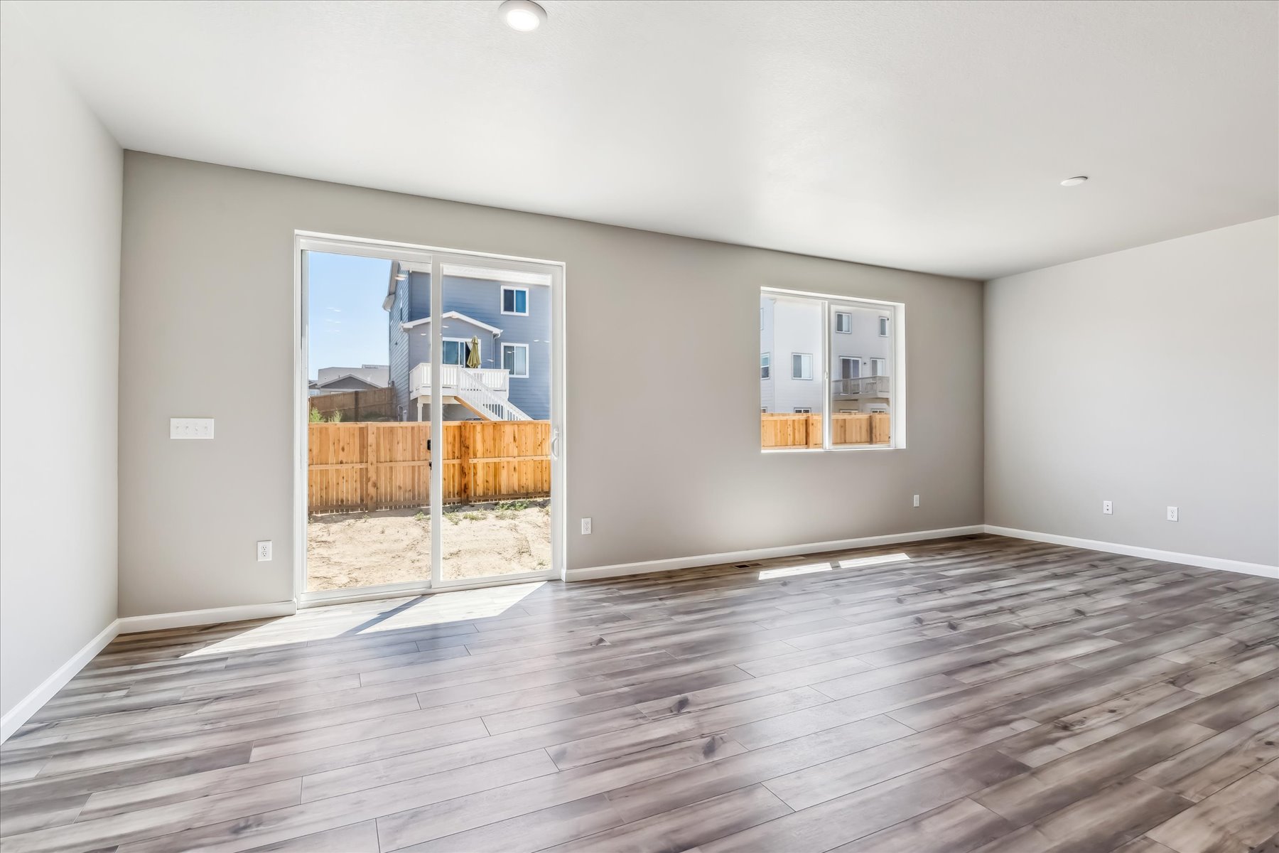 A room with a wood floor and a wood floor.