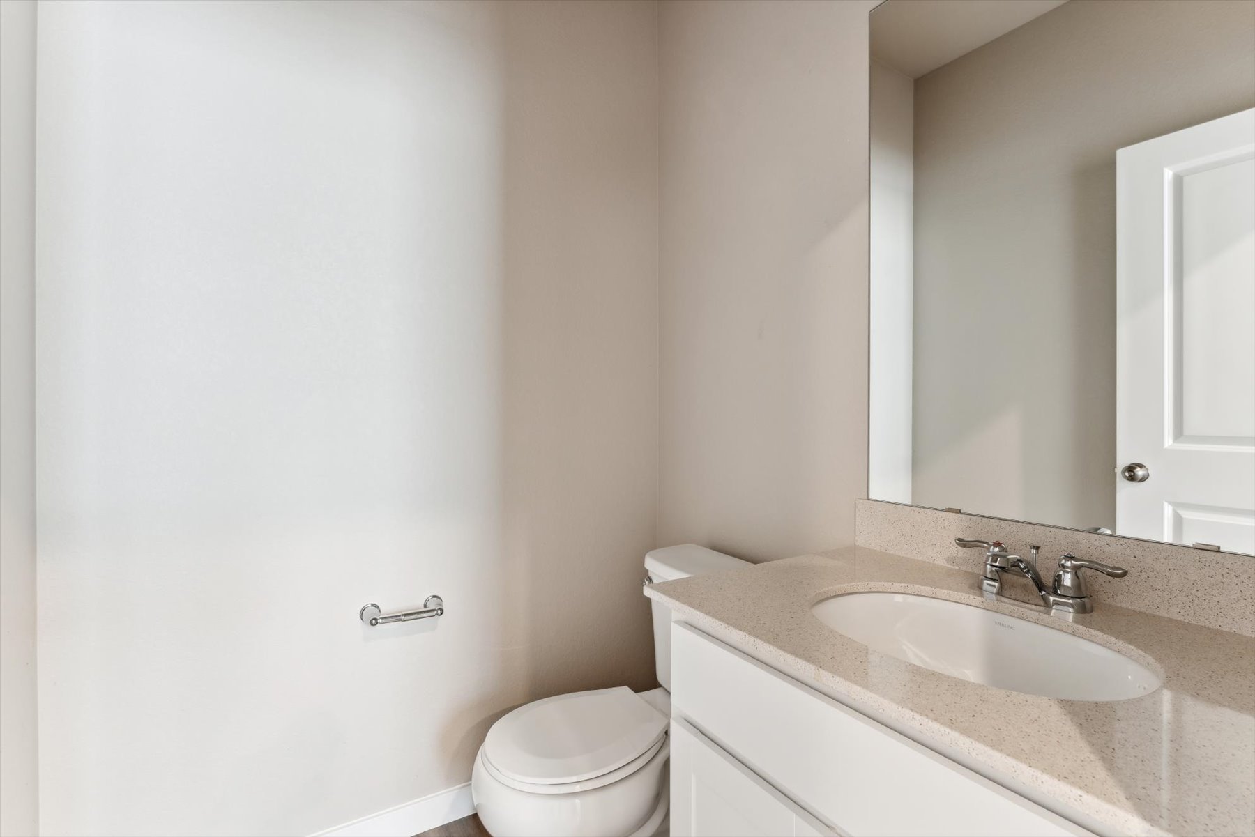 A bathroom with a sink and a toilet.