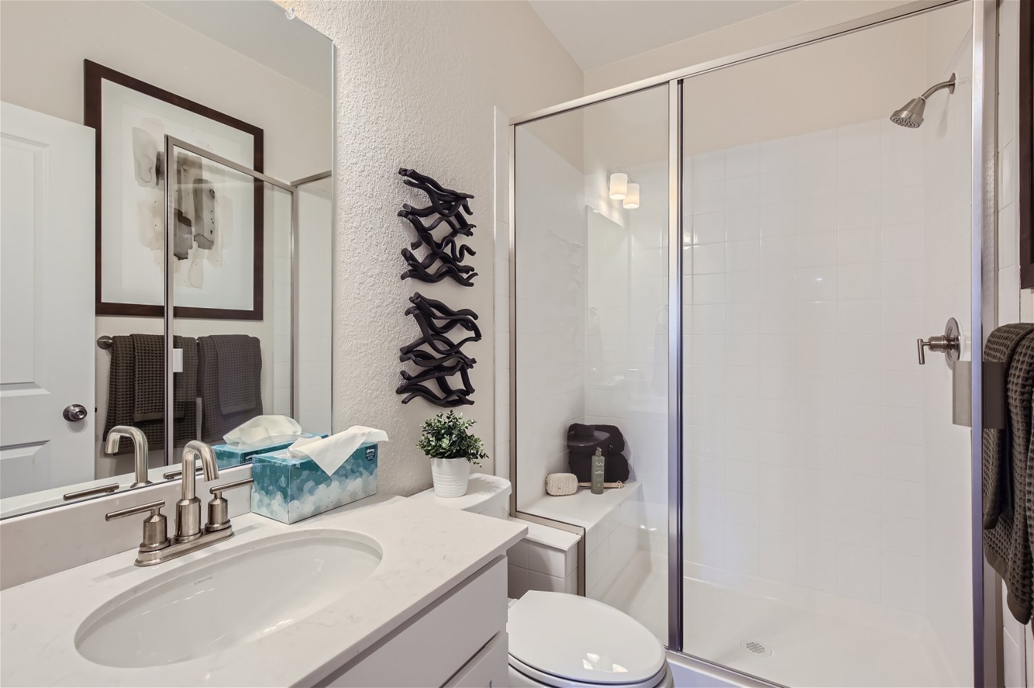 A bathroom with a glass shower.