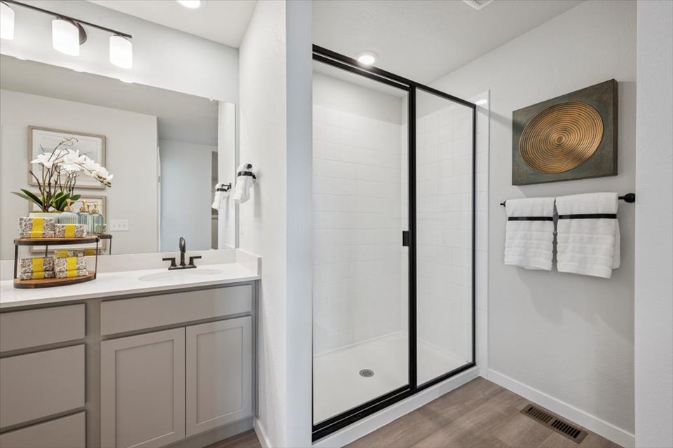A bathroom with a glass shower.