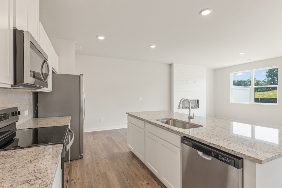 A kitchen with stainless steel appliances.