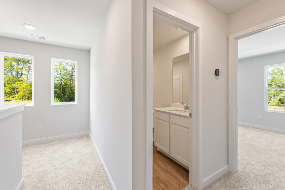 A bathroom with white walls.