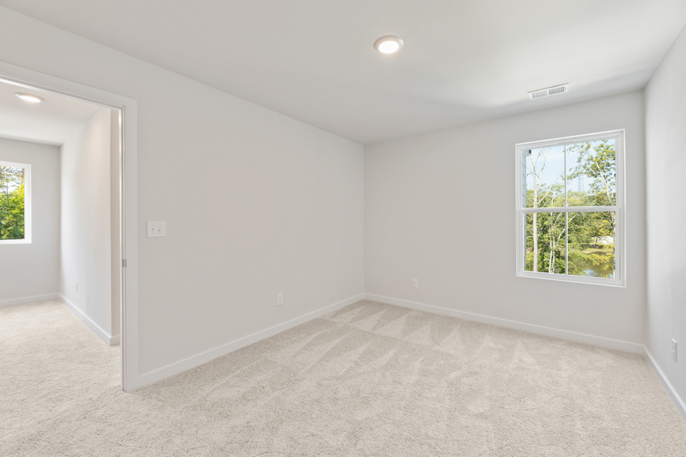 A room with a window and a door.