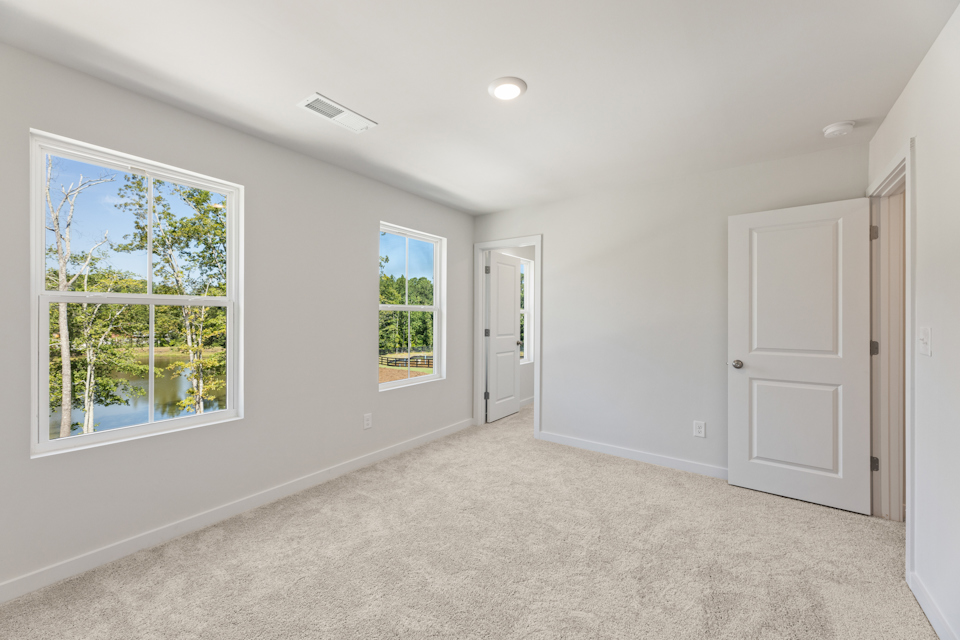 A room with white walls and windows.