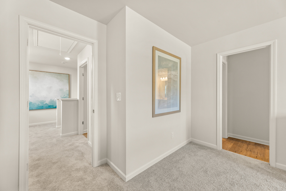 A hallway with white walls.