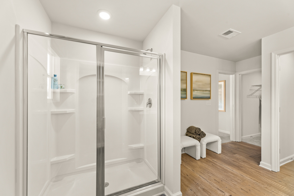 A bathroom with a glass shower.