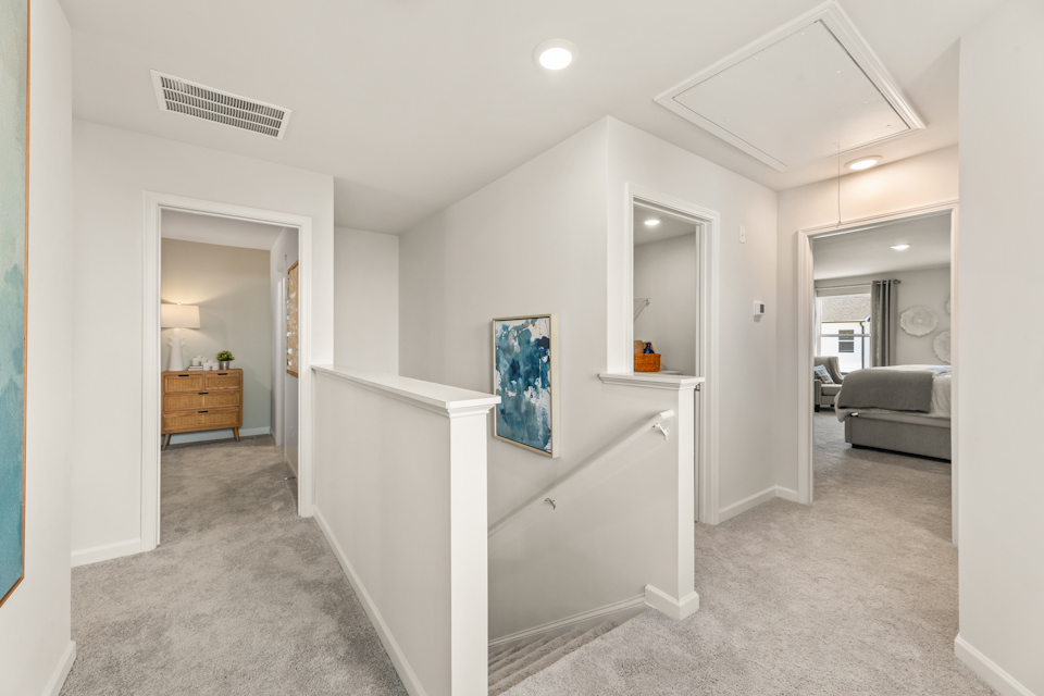 A white room with a bed and a couch.