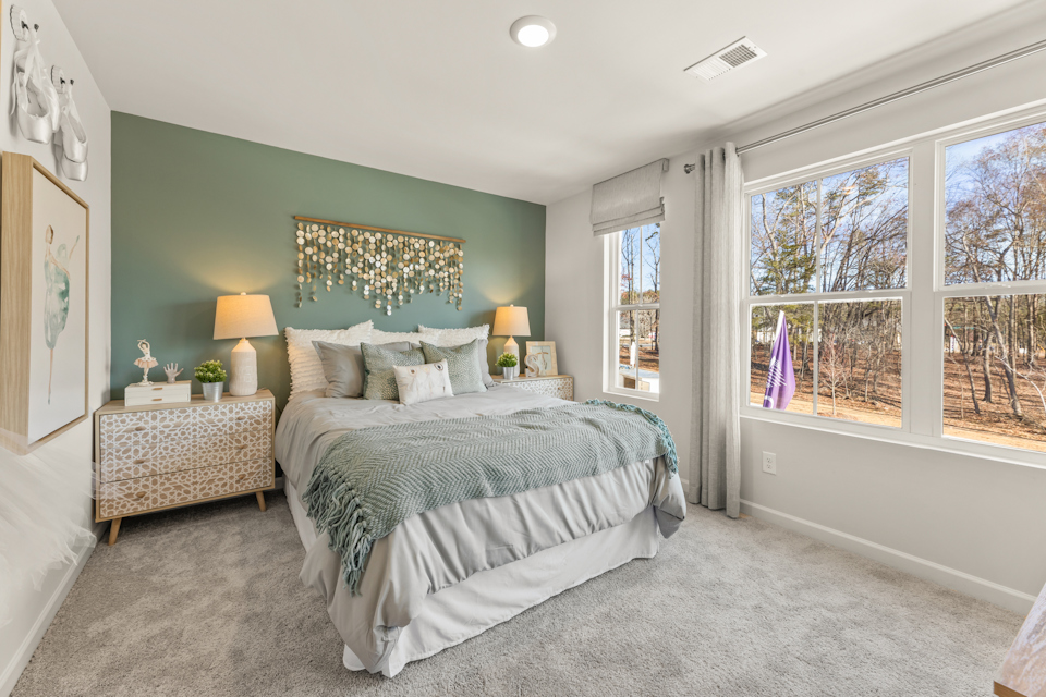 A bedroom with a large bed.