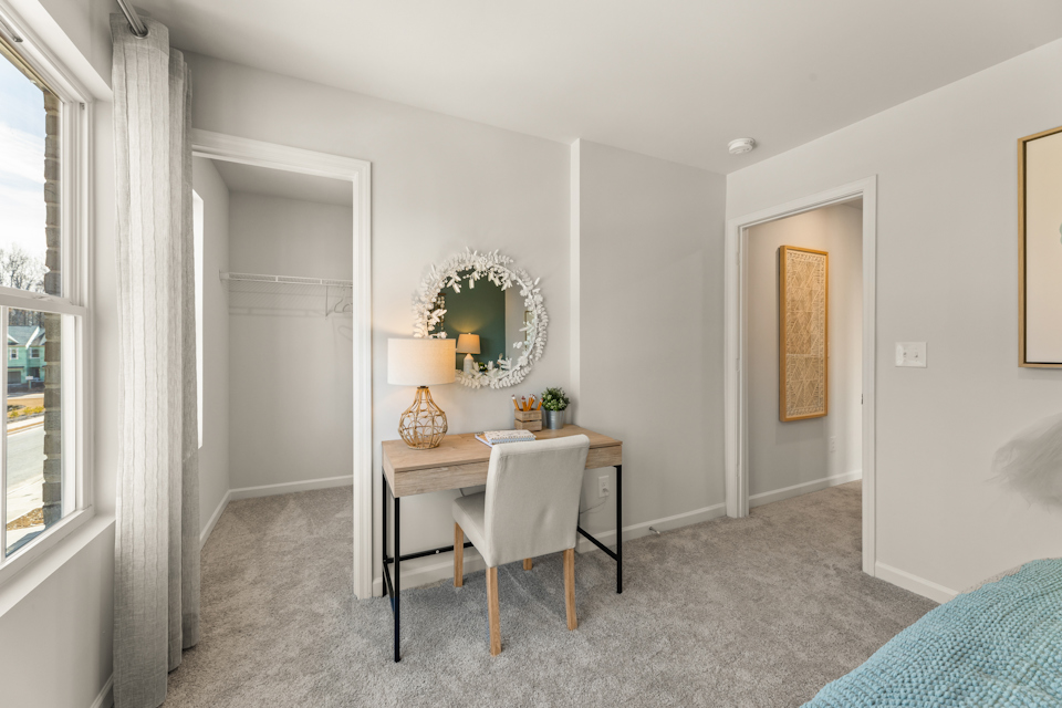 A room with a table and chairs.