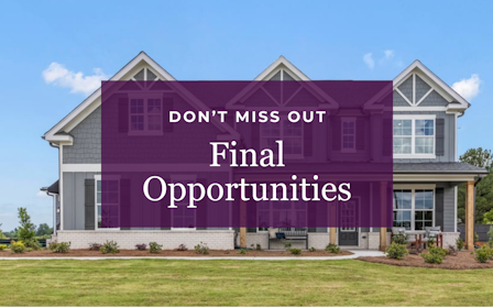 A large building with a sign in front of it.