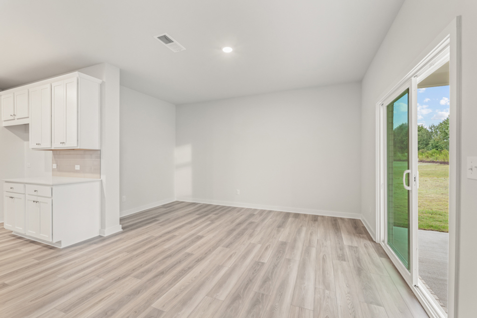 A room with white cabinets.