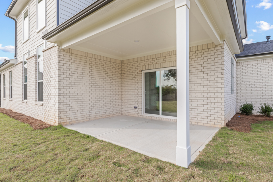 A house with a large front yard.