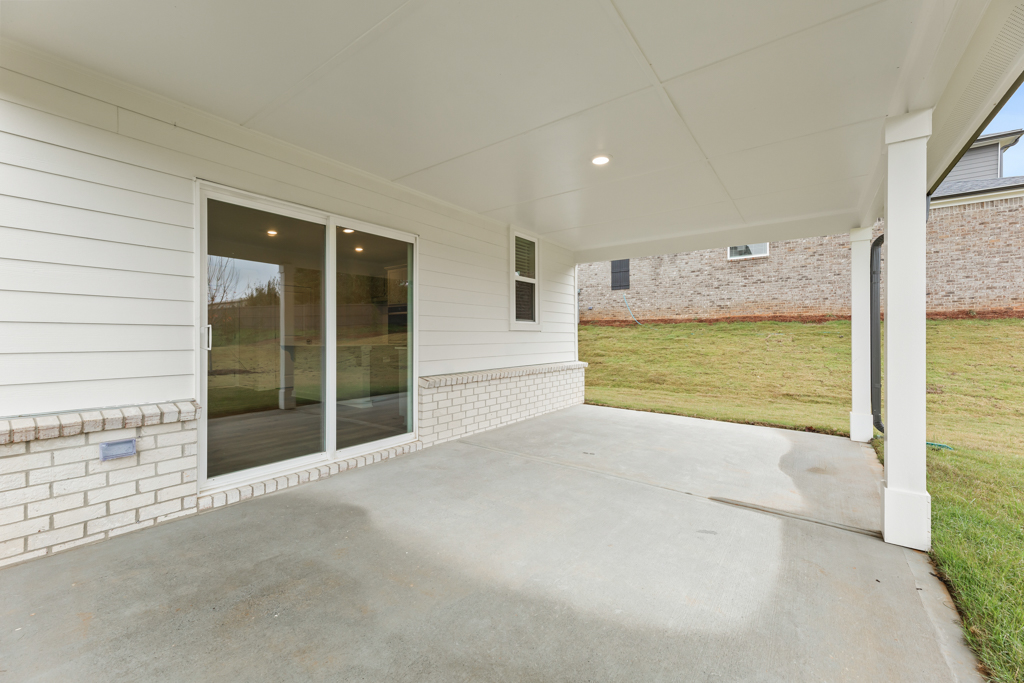 A white house with a glass door.