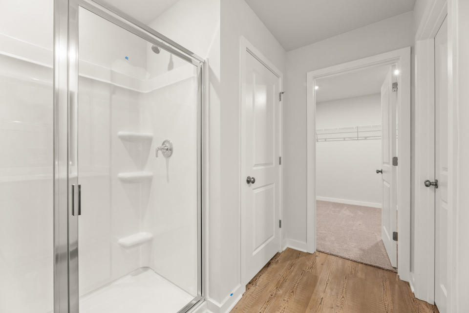 A bathroom with white doors.