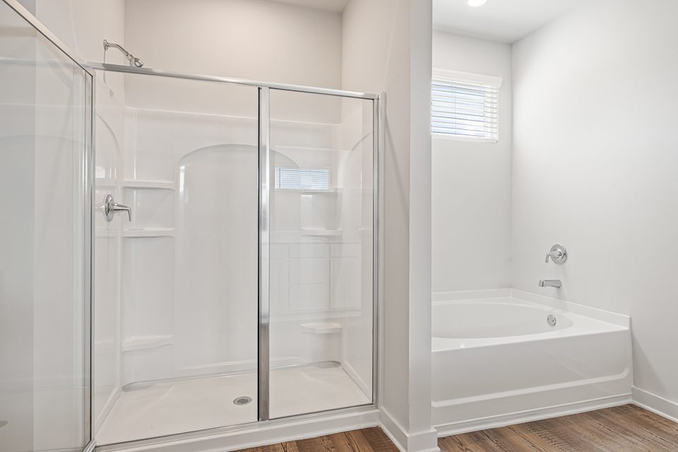 A bathroom with a glass shower.