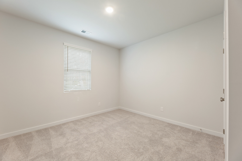 A room with a door and a window.