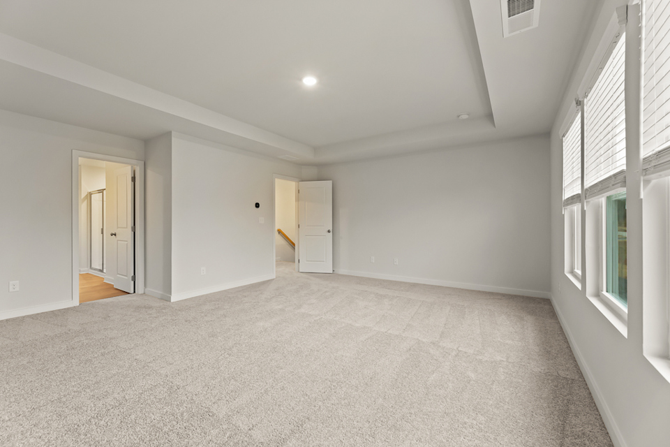 A room with white walls and windows.