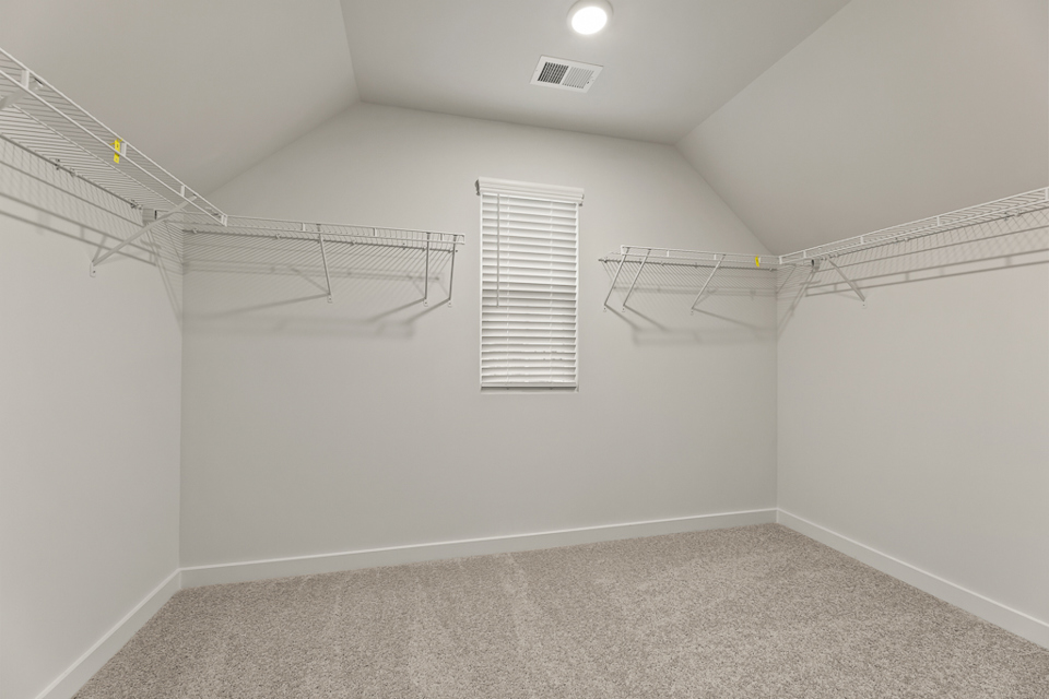 A white room with a staircase.