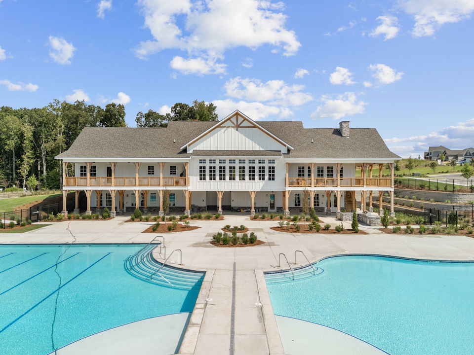 A large house with a pool.