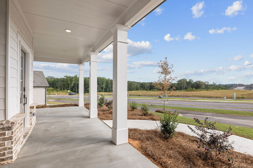 A building with pillars and a road.