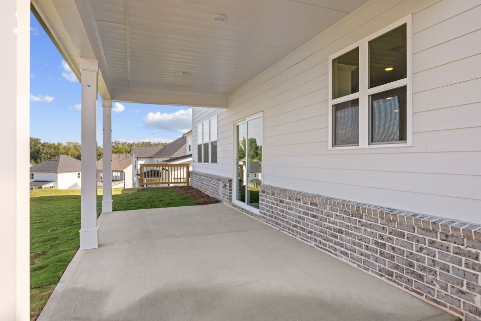 A house with a brick driveway.