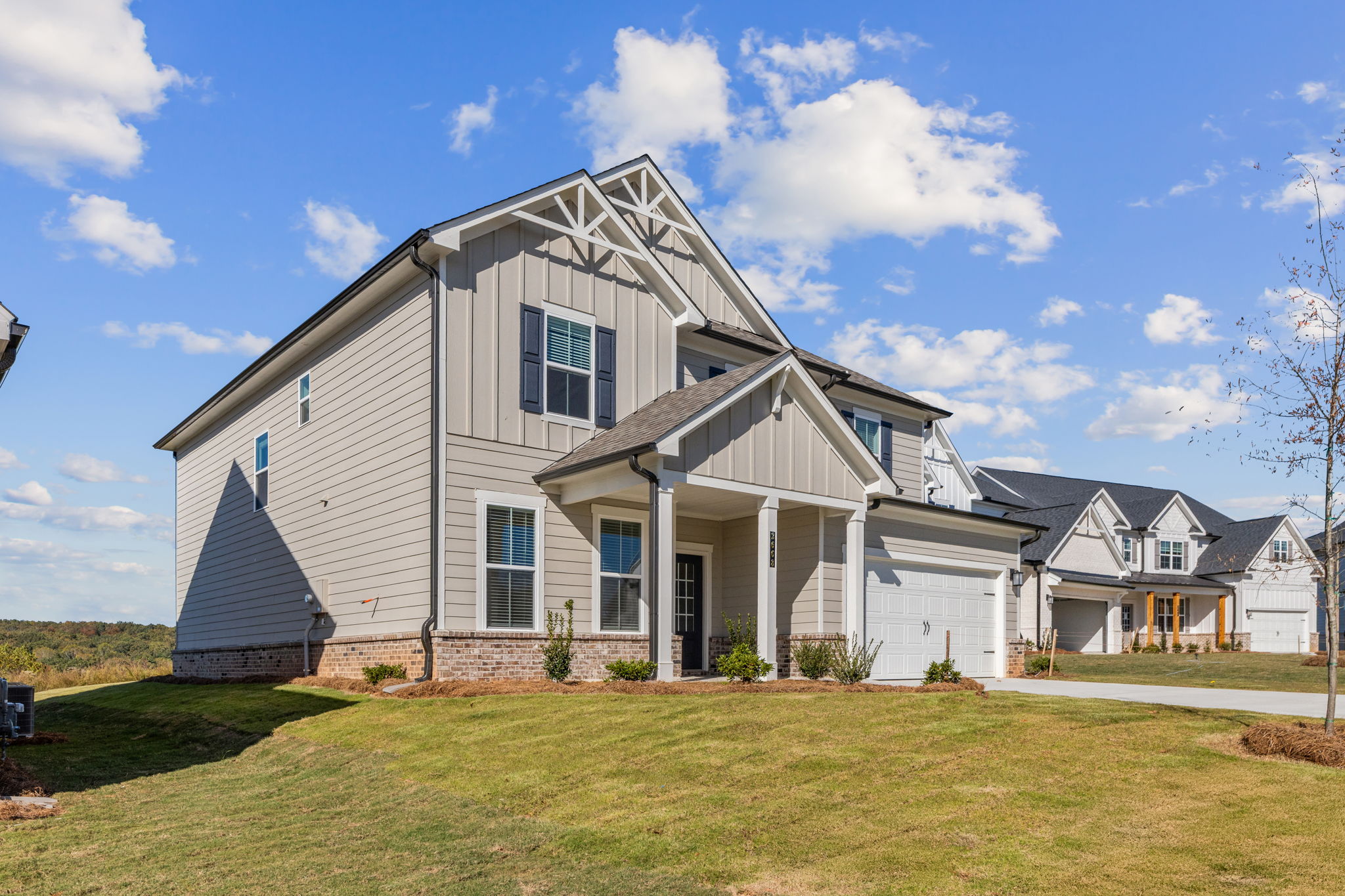 A house with a lawn in front of it.